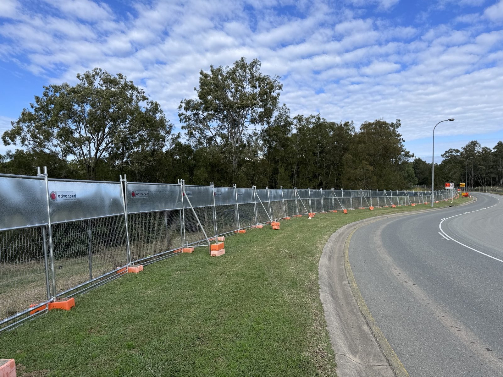 Temporary koala exclusion fencing along a work corridor